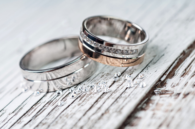 Wedding rings on rustic wood
